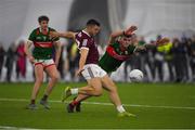 14 January 2023; Damien Comer of Galway in action against Jordan Flynn of Mayo during the Connacht FBD League Semi-Final match between Mayo and Galway at NUI Galway Connacht GAA Air Dome in Bekan, Mayo. Photo by Ray Ryan/Sportsfile