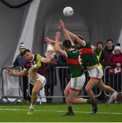 14 January 2023; Damien Comer of Galway in action against Stephen Coen of Mayo during the Connacht FBD League Semi-Final match between Mayo and Galway at NUI Galway Connacht GAA Air Dome in Bekan, Mayo. Photo by Ray Ryan/Sportsfile