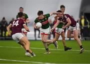 14 January 2023; Fenton Kelly of Mayo in action against Johnny Heaney of Galway during the Connacht FBD League Semi-Final match between Mayo and Galway at NUI Galway Connacht GAA Air Dome in Bekan, Mayo. Photo by Ray Ryan/Sportsfile