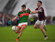 14 January 2023; Paul Towey of Mayo in action against Ian Burke of Galway during the Connacht FBD League Semi-Final match between Mayo and Galway at NUI Galway Connacht GAA Air Dome in Bekan, Mayo. Photo by Ray Ryan/Sportsfile