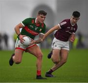 14 January 2023; Jordan Flynn of Mayo in action against Tomo Culhane of Galway during the Connacht FBD League Semi-Final match between Mayo and Galway at NUI Galway Connacht GAA Air Dome in Bekan, Mayo. Photo by Ray Ryan/Sportsfile