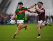 14 January 2023; Paul Towey of Mayo in action against Ian Burke of Galway during the Connacht FBD League Semi-Final match between Mayo and Galway at NUI Galway Connacht GAA Air Dome in Bekan, Mayo. Photo by Ray Ryan/Sportsfile