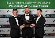 14 January 2023; Goalkeeper of the Year award winner Alan Mannus of Shamrock Rovers is presented with the trophy by former goalkeeper Alan O'Neill, left, and Páraic Casey, son of the late Des Casey, during the SSE Airtricity / Soccer Writers Ireland Awards 2022 at The Clayton Hotel in Dublin. Photo by Stephen McCarthy/Sportsfile