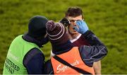 14 January 2023; Ronan Murphy of Galway receives attention from team physio Eamonn Duane, left, and team doctor Eoin McDonagh during the Walsh Cup Group 1 Round 2 match between Dublin and Galway at Parnell Park in Dublin. Photo by Daire Brennan/Sportsfile