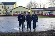 15 January 2023; Wexford management team, from left, manager Darragh Egan, selector Niall Corcoran, and strength and conditioning coach Declan Browne, make their way across the St Brendan's Primary School play ground to watch their side warm-up before the Walsh Cup Group 2 Round 2 match between Offaly and Wexford at St Brendan's Park in Birr, Offaly. Photo by Seb Daly/Sportsfile
