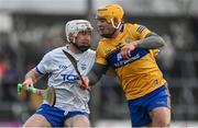 15 January 2023; Shane McNulty of Waterford is tackled by Mark Rodgers of Clare during the Co-Op Superstores Munster Hurling League Group 1 match between Clare and Waterford at Cusack Park in Ennis, Clare. Photo by Brendan Moran/Sportsfile