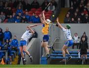 15 January 2023; Brandon O'Connell of Clare contests a dropping ball with Waterford players Stephen Bennett, left, and Michael Kiely the Co-Op Superstores Munster Hurling League Group 1 match between Clare and Waterford at Cusack Park in Ennis, Clare. Photo by Brendan Moran/Sportsfile