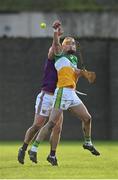 15 January 2023; Ross Ravenhill of Offaly in action against Gavin Bailey of Wexford during the Walsh Cup Group 2 Round 2 match between Offaly and Wexford at St Brendan's Park in Birr, Offaly. Photo by Seb Daly/Sportsfile