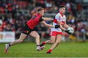 15 January 2023; Conor Doherty of Derry in action against Liam Kerr of Down during the Bank of Ireland Dr McKenna Cup Semi-Final match between Down and Derry at Pairc Esler in Newry, Down. Photo by Ben McShane/Sportsfile