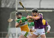 15 January 2023; Jason Sampson of Offaly in action against Conor McDonald of Wexford during the Walsh Cup Group 2 Round 2 match between Offaly and Wexford at St Brendan's Park in Birr, Offaly. Photo by Seb Daly/Sportsfile