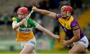 15 January 2023; Sam Bourke of Offaly in action against Lee Chin of Wexford during the Walsh Cup Group 2 Round 2 match between Offaly and Wexford at St Brendan's Park in Birr, Offaly. Photo by Seb Daly/Sportsfile