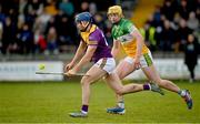 15 January 2023; Shane Reck of Wexford in action against Killian Sampson of Offaly during the Walsh Cup Group 2 Round 2 match between Offaly and Wexford at St Brendan's Park in Birr, Offaly. Photo by Seb Daly/Sportsfile