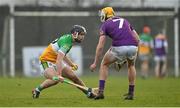 15 January 2023; David Nally of Offaly in action against Ian Carty of Wexford during the Walsh Cup Group 2 Round 2 match between Offaly and Wexford at St Brendan's Park in Birr, Offaly. Photo by Seb Daly/Sportsfile