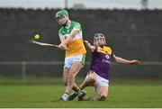 15 January 2023; John Murphy of Offaly in action against Eoin Murphy of Wexford during the Walsh Cup Group 2 Round 2 match between Offaly and Wexford at St Brendan's Park in Birr, Offaly. Photo by Seb Daly/Sportsfile