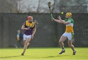 15 January 2023; Conor Hearne of Wexford in action against Killian Sampson of Offaly during the Walsh Cup Group 2 Round 2 match between Offaly and Wexford at St Brendan's Park in Birr, Offaly. Photo by Seb Daly/Sportsfile
