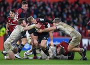 14 January 2023; Craig Casey of Munster is tackled by Paul Hill, left, and Mike Haywood of Northampton Saints during the Heineken Champions Cup Pool B Round 3 match between Munster and Northampton Saints at Thomond Park in Limerick. Photo by Tyler Miller/Sportsfile