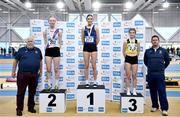 14 January 2023; Athletics Ireland President John Cronin, left, and jumps coach David Murphy with junior women's triple jump medallists, Emma O'Neill of Carrick-on-Suir AC, Waterford, gold, Molly Mullally of Dundrum South Dublin AC, silver, and Caoimhe Mc Donagh of South Sligo AC, bronze, during the 123.ie National Junior and U23 Indoor Athletics Championships at the National Indoor Arena in Dublin. Photo by Sam Barnes/Sportsfile