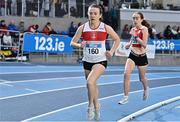 14 January 2023; Anna Mc Ginley of Galway City Harriers AC, left, and Clare Barrett of DMP AC, Wexford, compete in the under 23 women's 1500m during the 123.ie National Junior and U23 Indoor Athletics Championships at the National Indoor Arena in Dublin. Photo by Sam Barnes/Sportsfile