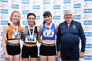 14 January 2023; Mick McKeon with U23 women's 1500m medallists, Kelly Breen of North East Runners AC, Louth, gold, Lauren Murphy of Cilles AC, Meath, silver, and Roisin O'Reilly of UCD AC, Dublin, bronze, during the 123.ie National Junior and U23 Indoor Athletics Championships at the National Indoor Arena in Dublin. Photo by Sam Barnes/Sportsfile