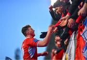 17 January 2023; Hugh Quigley of CUS celebrates with supporters after the Bank of Ireland Vinnie Murray Cup Second Round match between CUS and The King’s Hospital at Energia Park in Dublin. Photo by Ben McShane/Sportsfile