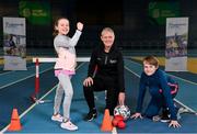 18 January 2023; Community Games and Sport Ireland Coaching today certified new tutors for their Coaching Children programme. Pictured are newly certified leader tutor Marian Boylan, centre, with young athletes Emily Moylan, age 9, and her brother Jack, age 12, from Dublin, at the National Indoor Arena in Dublin. Photo by Seb Daly/Sportsfile