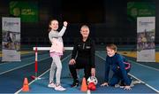18 January 2023; Community Games and Sport Ireland Coaching today certified new tutors for their Coaching Children programme. Pictured are newly certified leader tutor Marian Boylan, centre, with young athletes Emily Moylan, age 9, and her brother Jack, age 12, from Dublin, at the National Indoor Arena in Dublin. Photo by Seb Daly/Sportsfile