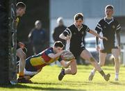 19 January 2023; Alex Gallagher of St Fintan's High School dives over to score a try during the Bank of Ireland Fr Godfrey Cup Second Round match between St Fintan's High School and Ardscoil na Tríonóide at Old Belvedere RFC in Dublin. Photo by Harry Murphy/Sportsfile