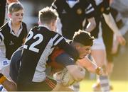 19 January 2023; Oisin Kelly of St Fintan's High School is tackled by Fionn Whelan of Ardscoil na Tríonóide during the Bank of Ireland Fr Godfrey Cup Second Round match between St Fintan's High School and Ardscoil na Tríonóide at Old Belvedere RFC in Dublin. Photo by Harry Murphy/Sportsfile