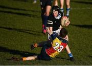 19 January 2023; Ben Talt of Ardscoil na Tríonóide is tackled by Shane Hanratty of St Fintan's High School during the Bank of Ireland Fr Godfrey Cup Second Round match between St Fintan's High School and Ardscoil na Tríonóide at Old Belvedere RFC in Dublin. Photo by Harry Murphy/Sportsfile