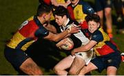19 January 2023; Daniel Henry of Ardscoil na Tríonóide is tackled by Michael Bolger and Luca Macari-Kelly of St Fintan's High School during the Bank of Ireland Fr Godfrey Cup Second Round match between St Fintan's High School and Ardscoil na Tríonóide at Old Belvedere RFC in Dublin. Photo by Harry Murphy/Sportsfile