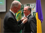 14 January 2023; The new Leinster Council Chairman Derek Kent, of Wexford, has a medal pinned to his collar by the outgoing Chairman Pat Teehan, of Offaly, left, as he takes over during the Leinster GAA Convention at Clayton Whites Hotel in Wexford. Photo by Ray McManus/Sportsfile