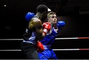 20 January 2023; Davey Joyce of Holy Family Drogheda Boxing Club, Louth, right, Bayo Alabi of Westside Boxing Club, Dublin, during their lightweight 60kg semi-final bout at the IABA National Elite Boxing Championships semi-finals at the National Boxing Stadium in Dublin. Photo by Seb Daly/Sportsfile