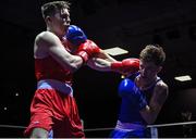 20 January 2023; John Paul Hale of Star ABC, Belfast, left, and Dean Clancy of Sean McDermott Boxing Club, Leitrim, during their light welterweight 63.5kg semi-final bout at the IABA National Elite Boxing Championships semi-finals at the National Boxing Stadium in Dublin. Photo by Seb Daly/Sportsfile
