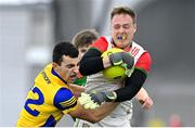 20 January 2023; Mayo goalkeeper Colm Reape is tackled by Ciarán Lennon of Roscommon during the Connacht FBD League Final match between Mayo and Roscommon at NUI Galway Connacht GAA Air Dome in Bekan, Mayo. Photo by Piaras Ó Mídheach/Sportsfile