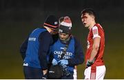 20 January 2023; Luke Fahy of Cork receives medical attention for an injury during the McGrath Cup Final match between Cork and Limerick at Mallow GAA Grounds in Mallow, Cork. Photo by Eóin Noonan/Sportsfile