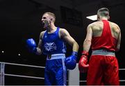 20 January 2023; Dean Walsh of St Ibars/St Josephs Boxing Club, Wexford, left, celebrates after victory over Aidan Walsh of Emerald ABC, Belfast, in their light middleweight 71kg semi-final bout at the IABA National Elite Boxing Championships semi-finals at the National Boxing Stadium in Dublin. Photo by Seb Daly/Sportsfile