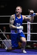 20 January 2023; Dean Walsh of St Ibars/St Josephs Boxing Club, Wexford, celebrates after victory over  Aidan Walsh of Emerald ABC, Belfast, during their light middleweight 71kg semi-final bout at the IABA National Elite Boxing Championships semi-finals at the National Boxing Stadium in Dublin. Photo by Seb Daly/Sportsfile