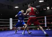 20 January 2023; Dean Walsh of St Ibars/St Josephs Boxing Club, Wexford, left, and Aidan Walsh of Emerald ABC, Belfast, during their light middleweight 71kg semi-final bout at the IABA National Elite Boxing Championships semi-finals at the National Boxing Stadium in Dublin. Photo by Seb Daly/Sportsfile