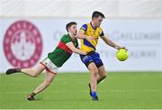 20 January 2023; Brian Stack of Roscommon in action against Conor McStay of Mayo during the Connacht FBD League Final match between Mayo and Roscommon at NUI Galway Connacht GAA Air Dome in Bekan, Mayo. Photo by Piaras Ó Mídheach/Sportsfile