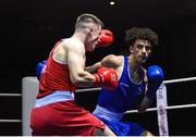 20 January 2023; Joshua Olaniyan of Jobstown Boxing Club, Dublin, right, and Eoghin Lavin of Ballyhaunis Boxing Club, Mayo, during their middleweight 75kg semi-final bout at the IABA National Elite Boxing Championships semi-finals at the National Boxing Stadium in Dublin. Photo by Seb Daly/Sportsfile