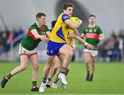 20 January 2023; Keith Doyle of Roscommon in action against Aiden Orme, left, and Jack Coyne of Mayo during the Connacht FBD League Final match between Mayo and Roscommon at NUI Galway Connacht GAA Air Dome in Bekan, Mayo. Photo by Piaras Ó Mídheach/Sportsfile