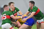 20 January 2023; Cian Glennon of Roscommon is tackled by Mayo players, from left, Ryan O'Donoghue, Donnacha McHugh and Enda Hession during the Connacht FBD League Final match between Mayo and Roscommon at NUI Galway Connacht GAA Air Dome in Bekan, Mayo. Photo by Piaras Ó Mídheach/Sportsfile