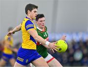 20 January 2023; Keith Doyle of Roscommon in action against Bob Tuohy of Mayo during the Connacht FBD League Final match between Mayo and Roscommon at NUI Galway Connacht GAA Air Dome in Bekan, Mayo. Photo by Piaras Ó Mídheach/Sportsfile