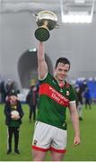 20 January 2023; Mayo captain Stephen Coen lifts the cup after his side's victory in the Connacht FBD League Final match between Mayo and Roscommon at NUI Galway Connacht GAA Air Dome in Bekan, Mayo. Photo by Piaras Ó Mídheach/Sportsfile