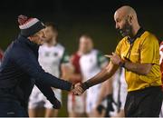 20 January 2023; Cork manager John Cleary with referee Brian Fleming after the McGrath Cup Final match between Cork and Limerick at Mallow GAA Grounds in Mallow, Cork. Photo by Eóin Noonan/Sportsfile