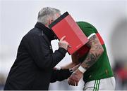 20 January 2023; Mayo assistant manager Stephen Rochford covers his face as he talks with Jordan Flynn of Mayo during the Connacht FBD League Final match between Mayo and Roscommon at NUI Galway Connacht GAA Air Dome in Bekan, Mayo. Photo by Piaras Ó Mídheach/Sportsfile