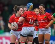 21 January 2023; Deirbhile Nic a Bháird (left) of Munster is congratulated by team mates after scoring a try during the Vodafone Women’s Interprovincial Championship Round Three match between Connacht and Munster at The Sportsground in Galway. Photo by Ray Ryan/Sportsfile
