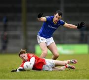 21 January 2023; Shane Matthews of Louth in action against Darren Gallagher of Longford during the O'Byrne Cup Final match between Longford and Louth at Glennon Brothers Pearse Park in Longford. Photo by Ray McManus/Sportsfile