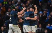 21 January 2023; Jimmy O'Brien of Leinster, right, celebrates after scoring his side's first try with team mates Jordan Larmour, centre, and Caelan Doris during the Heineken Champions Cup Pool A Round 4 match between Leinster and Racing 92 at Aviva Stadium in Dublin. Photo by David Fitzgerald/Sportsfile