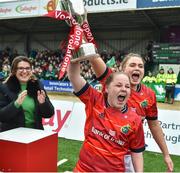 21 January 2023; Munster captain Nicole Cronin and Dorothy Wall of Munster lift the cup to celebrate with team mates after the match in the Vodafone Women’s Interprovincial Championship Round Three match between Connacht and Munster at The Sportsground in Galway. Photo by Ray Ryan/Sportsfile